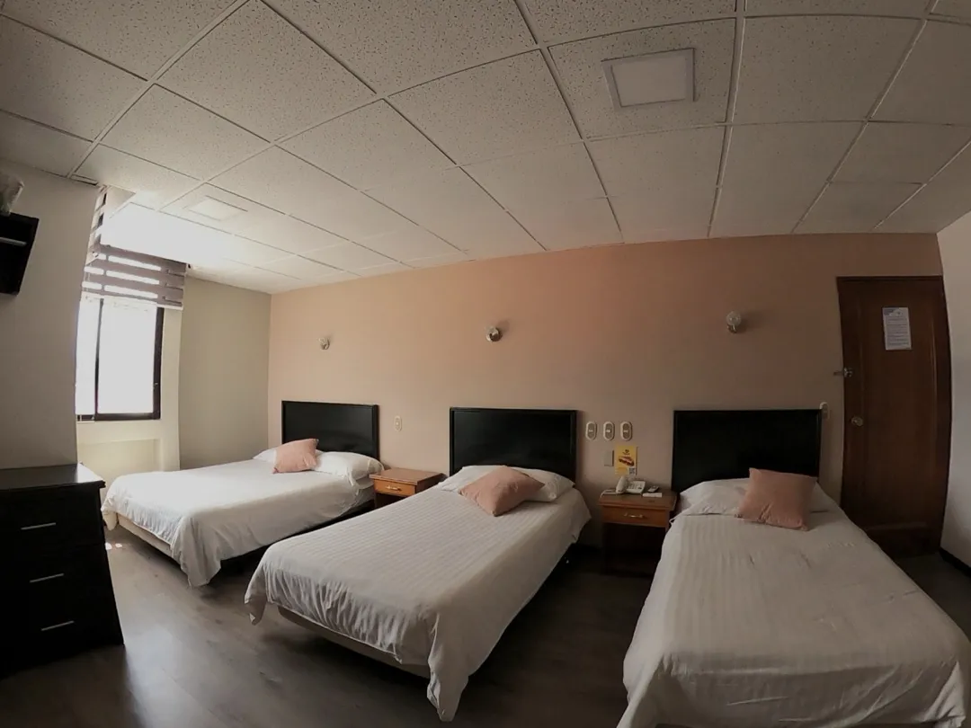 Family Room with three beds at Hotel Italia Cuenca